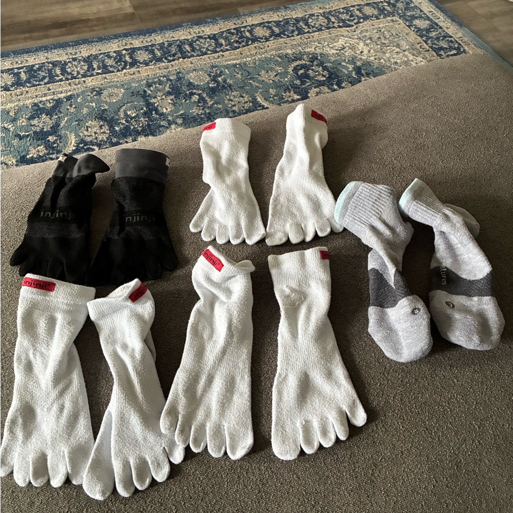4 pairs of Injinji toe socks (medium) 1 pair of Feetures max cushion trail socks